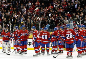 MONTREAL- APRIL 22:  Members of the Montreal Canadiens wave to fans after being defeated 4-1 by the Boston Bruins in Game Four of the Eastern Conference Quarterfinals of the 2009 Stanley Cup Playoffs at the Bell Centre on April 22, 2009 in Montreal, Quebec, Canada.  The Bruins defeated the Canadiens 4-1 winning the series 4-0.  (Photo by Richard Wolowicz/Getty Images)