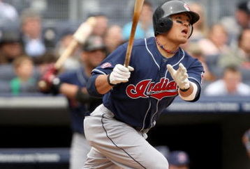 NEW YORK - APRIL 19:  Shin-soo Choo #17 of the Cleveland Indians hits a home run in the second inning of their game against the New York Yankees at Yankee Stadium on April 19, 2009 in the Bronx borough of New York City.  (Photo by Ezra Shaw/Getty Images)