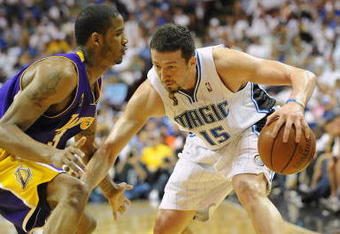 ORLANDO, FL - JUNE 14:  Hedo Turkoglu #15 of the Orlando Magic moves the ball against Trevor Ariza #3 of the Los Angeles Lakers in Game Five of the 2009 NBA Finals on June 14, 2009 at Amway Arena in Orlando, Florida. The Lakers won 99-86.  NOTE TO USER:  User expressly acknowledges and agrees that, by downloading and or using this photograph, User is consenting to the terms and conditions of the Getty Images License Agreement. (Photo by Ronald Martinez/Getty Images) 