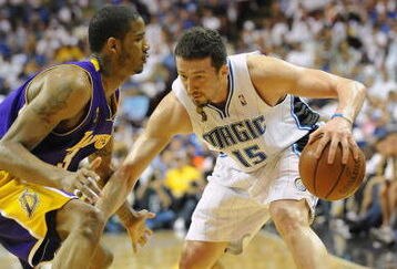 ORLANDO, FL - JUNE 14:  Hedo Turkoglu #15 of the Orlando Magic moves the ball against Trevor Ariza #3 of the Los Angeles Lakers in Game Five of the 2009 NBA Finals on June 14, 2009 at Amway Arena in Orlando, Florida. The Lakers won 99-86.  NOTE TO USER:  User expressly acknowledges and agrees that, by downloading and or using this photograph, User is consenting to the terms and conditions of the Getty Images License Agreement. (Photo by Ronald Martinez/Getty Images) 