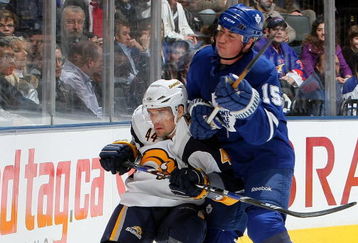 TORONTO - APRIL 8:  Tomas Kaberle #15 of the Toronto Maple Leafs checks Andrej Sekera #44 of the Buffalo Sabres during a NHL game at the Air Canada Centre April 8, 2009 in Toronto, Ontario.(Photo By Dave Sandford/Getty Images)