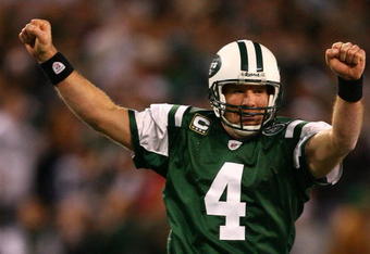 EAST RUTHERFORD, NJ - DECEMBER 28: Brett Favre #4 of The New York Jets celebrates after throwing a touchdown to Laveranues Coles #87 against The Miami Dolphins during their game on December 28, 2008 at Giants Stadium in East Rutherford, New Jersey. (Photo by Al Bello/Getty Images)