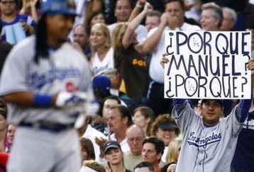 SAN DIEGO - JULY 3:  A fan holds up a sign after Manny Ramirez #99 of the Los Angeles Dodgers grounded out in the second inning against the San Diego Padres during the game on July 3, 2009 at Petco Park in San Diego, California. (Photo by Jeff Gross/Getty Images)