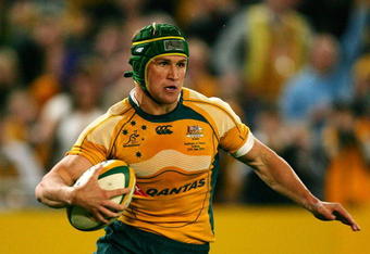 SYDNEY, AUSTRALIA - JUNE 27:  Matt Giteau of the Wallabies crosses the line to score a try during the Test match between the Australian Wallabies and France at ANZ Stadium on June 27, 2009 in Sydney, Australia.  (Photo by Matt King/Getty Images)