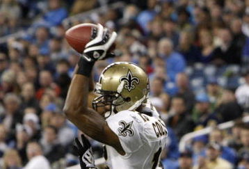 DETROIT - DECEMBER 21:  Wide receiver Marques Colston #12 of the New Orleans Saints scores on a six yard pass in the third quarter as Detroit Lions cornerback Ramzee Robinson #38 attempts to defend on December 21, 2008 at Ford Field in Detroit, Michigan. The New Orleans Saints defeated the Detroit Lions 42-7.  (Photo by Leon Halip/Getty Images)