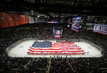 UNIONDALE, NY - OCTOBER 11: Pregame cermenoies before the St. Louis Blues took on the New York Islanders included youth hockey players holding an American flag during the national anthem on October 11, 2008 at the Nassau Coliseum in Uniondale, New York. (Photo by Bruce Bennett/Getty Images)