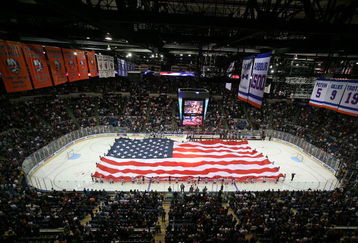 UNIONDALE, NY - OCTOBER 11: Pregame cermenoies before the St. Louis Blues took on the New York Islanders included youth hockey players holding an American flag during the national anthem on October 11, 2008 at the Nassau Coliseum in Uniondale, New York. (Photo by Bruce Bennett/Getty Images)