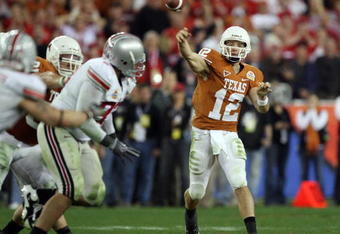 GLENDALE, AZ - JANUARY 05:  Quarterback Colt McCoy #12 of the Texas Longhorns throws a pass against the Ohio State Buckeyes during the Tostitos Fiesta Bowl Game on January 5, 2009 at University of Phoenix Stadium in Glendale, Arizona.   The Longhorns defeated the Buckeyes 24-21.  (Photo by Jed Jacobsohn/Getty Images)