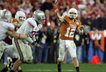 GLENDALE, AZ - JANUARY 05:  Quarterback Colt McCoy #12 of the Texas Longhorns throws a pass against the Ohio State Buckeyes during the Tostitos Fiesta Bowl Game on January 5, 2009 at University of Phoenix Stadium in Glendale, Arizona.   The Longhorns defeated the Buckeyes 24-21.  (Photo by Jed Jacobsohn/Getty Images)