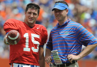 GAINESVILLE, FL - APRIL 18: Quarterback Tim Tebow #15 of the University of Florida talks with quarterbacks coach Scott Loeffler  during the spring football Orange and Blue game April 18, 2009 at Ben Hill Griffin Stadium in Gainesville, Florida.  (Photo by Al Messerschmidt/Getty Images)