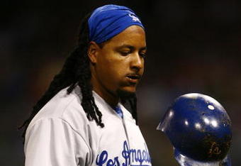 SAN DIEGO - JULY 3:  Manny Ramirez #99 of the Los Angeles Dodgers tosses his helmet against the San Diego Padres during the game on July 3, 2009 at Petco Park in San Diego, California. (Photo by Jeff Gross/Getty Images)