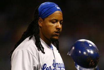 SAN DIEGO - JULY 3:  Manny Ramirez #99 of the Los Angeles Dodgers tosses his helmet against the San Diego Padres during the game on July 3, 2009 at Petco Park in San Diego, California. (Photo by Jeff Gross/Getty Images)