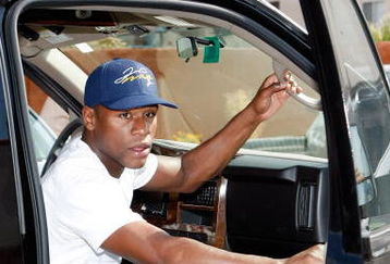 LAS VEGAS - JUNE 11:  Boxer Floyd Mayweather, Jr. arrives at his boxing gym June 11, 2009 in Las Vegas, Nevada. Mayweather, who is training for his welterweight fight against Juan Manuel Marquez on June 18, put an American flag wrap outside his gym in recognition of Flag Day on June 14.  (Photo by Ethan Miller/Getty Images)