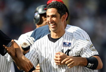 NEW YORK - JULY 04:  Jorge Posada #20 of the New York Yankees celebrates hitting a game winning single in the 12th inning against the Toronto Blue Jays on July 4, 2009 at Yankee Stadium in the Bronx borough of New York City.  (Photo by Nick Laham/Getty Images)