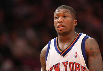 NEW YORK - MARCH 07:  Nate Robinson #4 of the New York Knicks looks on against the Charlotte Bobcats on March 7, 2009 at Madison Square Garden in New York City. NOTE TO USER: User expressly acknowledges and agrees that, by downloading and or using this photograph, User is consenting to the terms and conditions of the Getty Images License Agreement.  (Photo by Nick Laham/Getty Images)