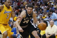 LOS ANGELES - MAY 11:  Hidayet Turkoglu #14 of the San Antonio Spurs drives on Devean George #3 of the Los Angeles Lakers in Game four of the Western Conference Semifinals during the 2004 NBA Playoffs at Staples Center on May 11, 2004 in Los Angeles, California.  The Lakers won 98-90.  NOTE TO USER: User expressly acknowledges and agrees that, by downloading and/or using this Photograph, user is consenting to the terms and conditions of the Getty Images License Agreement. (Photo by Lisa Blumenfeld/Getty Images)