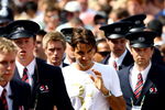 WIMBLEDON, ENGLAND - JULY 04:  Roger Federer is escorted by security guards after a practice session on Day Twelve of the Wimbledon Lawn Tennis Championships at the All England Lawn Tennis and Croquet Club on July 4, 2009 in London, England.  (Photo by Julian Finney/Getty Images)