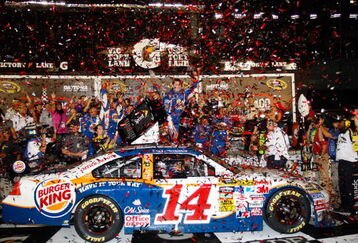 DAYTONA BEACH, FL - JULY 04: Tony Stewart, driver of the #14 Burger King Chevrolet, celebrates in victory lane after winning the NASCAR Sprint Cup Series 51st Annual Coke Zero 400 at Daytona International Speedway on July 4, 2009 in Daytona Beach, Florida.  (Photo by Geoff Burke/Getty Images for NASCAR)