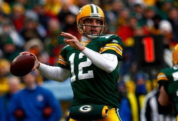 GREEN BAY, WI - DECEMBER 07:  Quarterback Aaron Rodgers #12 of the Green Bay Packers drops back to pass against the Houston Texans during the first quarter at Lambeau Field on December 7, 2008 in Green Bay, Wisconsin. The Texans defeated the Packers 24-21.  (Photo by Jeff Gross/Getty Images)