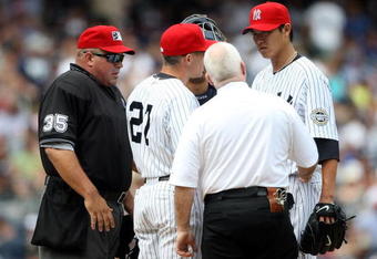 NEW YORK - JULY 04:  Chien-Ming Wang #40 of the New York Yankees leaves the game in the sixth inning with a strained right shoulder against the Toronto Blue Jays on July 4, 2009 at Yankee Stadium in the Bronx borough of New York City.  (Photo by Nick Laham/Getty Images)