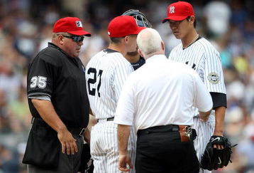 NEW YORK - JULY 04:  Chien-Ming Wang #40 of the New York Yankees leaves the game in the sixth inning with a strained right shoulder against the Toronto Blue Jays on July 4, 2009 at Yankee Stadium in the Bronx borough of New York City.  (Photo by Nick Laham/Getty Images)