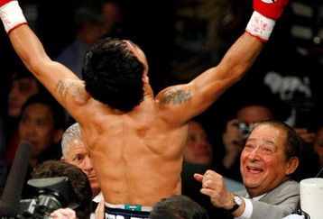 LAS VEGAS - MAY 02:  Manny Pacquiao of the Philippines celebrates with promoter Bob Arum after defeating Ricky Hatton of England in the second round of their junior welterweight title fight at the MGM Grand Garden Arena May 2, 2009 in Las Vegas, Nevada.  (Photo by Ethan Miller/Getty Images)