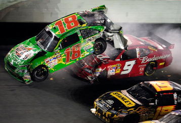 DAYTONA BEACH, FL - JULY 04:  Kasey Kahne, driver of the #9 Budweiser Dodge, crashes into the rear of Kyle Busch, driver of the #18 Interstate Batteries Toyota, after Kyle hit the wall on the final lap during the NASCAR Sprint Cup Series 51st Annual Coke Zero 400 at Daytona International Speedway on July 4, 2009 in Daytona Beach, Florida.  (Photo by Sam Greenwood/Getty Images)