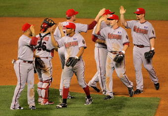 DENVER - JULY 04:  The Arizona Diamondbacks celebrate their victory over the Colorado Rockies during MLB action at Coors Field on July 4, 2009 in Denver, Colorado. The Diamondbacks defeated the Rockies 11-7.  (Photo by Doug Pensinger/Getty Images)