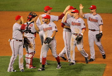 DENVER - JULY 04:  The Arizona Diamondbacks celebrate their victory over the Colorado Rockies during MLB action at Coors Field on July 4, 2009 in Denver, Colorado. The Diamondbacks defeated the Rockies 11-7.  (Photo by Doug Pensinger/Getty Images)