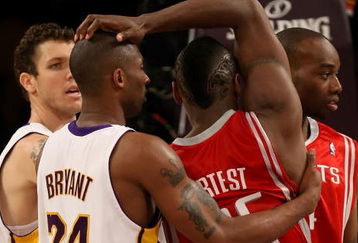 LOS ANGELES, CA - MAY 17:  Kobe Bryant #24 of the Los Angeles Lakers and Ron Artest #96 of the Houston Rockets get twisted up in the second quarter of Game Seven of the Western Conference Semifinals during the 2009 NBA Playoffs at Staples Center on May 17, 2009 in Los Angeles, California. NOTE TO USER: User expressly acknowledges and agrees that, by downloading and or using this photograph, User is consenting to the terms and conditions of the Getty Images License Agreement.  (Photo by Stephen Dunn/Getty Images)