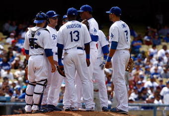 LOS ANGELES, CA - JUNE 06:  (L-R) Russell Martin #55, manager Joe Torre, Orlando Hudson #13, Ronald Belisario #54 and James Loney #7 of the Los Angeles Dodgers have a meeting at the mound against the Philadelphia Phillies at Dodger Stadium on June 6, 2009 in Los Angeles, California. The Dodgers defeated the Phillies 3-2 in twelve innings.  (Photo by Jeff Gross/Getty Images)