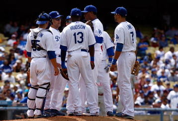 LOS ANGELES, CA - JUNE 06:  (L-R) Russell Martin #55, manager Joe Torre, Orlando Hudson #13, Ronald Belisario #54 and James Loney #7 of the Los Angeles Dodgers have a meeting at the mound against the Philadelphia Phillies at Dodger Stadium on June 6, 2009 in Los Angeles, California. The Dodgers defeated the Phillies 3-2 in twelve innings.  (Photo by Jeff Gross/Getty Images)