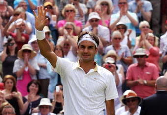 WIMBLEDON, ENGLAND - JULY 03:  Roger Federer of Switzerland waves to the crowd after victory during the men's singles semi final match against Tommy Haas of Germany on Day Eleven of the Wimbledon Lawn Tennis Championships at the All England Lawn Tennis and Croquet Club on July 3, 2009 in London, England.  (Photo by Hamish Blair/Getty Images)