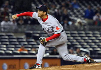 NEW YORK - MAY 05:  Takashi Saito #24 of the Boston Red Sox pitches against the New York Yankees on May 5, 2009 at Yankee Stadium in the Bronx borough of New York City. The Red Sox defeated the Yankees 7-3.  (Photo by Jim McIsaac/Getty Images)