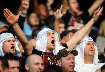 MANCHESTER, UNITED KINGDOM - SEPTEMBER 13:  Manchester City fans show their support during the Premier League match between Manchester City and Chelsea at The City of Manchester Stadium on September 13, 2008 in Manchester, England.  (Photo by Shaun Botterill/Getty Images)