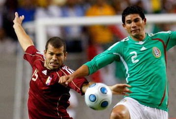 ATLANTA - JUNE 24:  Alejandro Moreno #15 of Venezuela battles for the ball against Jonny Magallon #2 of Mexico during their international friendly match at Georgia Dome June 24, 2009 in Atlanta, Georgia.  (Photo by Kevin C. Cox/Getty Images)