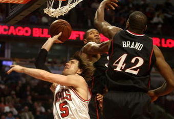 CHICAGO - DECEMBER 02:  Andres Nocioni #5 of the Chicago Bulls drives for a shot attempt against Elton Brand #42  of the Philadelphia 76ers at the United Center on December 2, 2008 in Chicago, Illinois.  NOTE TO USER: User expressly acknowledges and agrees that, by downloading and/or using this Photograph, user is consenting to the terms and conditions of the Getty Images License Agreement.  (Photo by Jonathan Daniel/Getty Images)