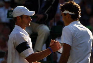 WIMBLEDON, ENGLAND - JULY 05:  Roger Federer of Switzerland shakes hands with Andy Roddick of USA after the men's singles final match on Day Thirteen of the Wimbledon Lawn Tennis Championships at the All England Lawn Tennis and Croquet Club on July 5, 2009 in London, England. Federer won 5-7, 7-6, 7-6, 3-6, 16-14.  (Photo by Clive Brunskill/Getty Images)