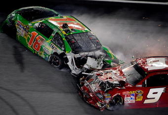 DAYTONA BEACH, FL - JULY 04: Kasey Kahne, driver of the #9 Budweiser Dodge, crashes into the rear of Kyle Busch, driver of the #18 Interstate Batteries Toyota, after Kyle hit the wall on the final lap during the NASCAR Sprint Cup Series 51st Annual Coke Zero 400 at Daytona International Speedway on July 4, 2009 in Daytona Beach, Florida.  (Photo by Sam Greenwood/Getty Images)