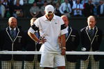 WIMBLEDON, ENGLAND - JULY 05:  Andy Roddick of USA looks despondent after defeat during the men's singles final match against Roger Federer of Switzerland on Day Thirteen of the Wimbledon Lawn Tennis Championships at the All England Lawn Tennis and Croquet Club on July 5, 2009 in London, England. Federer won 5-7, 7-6, 7-6, 3-6, 16-14.  (Photo by Clive Brunskill/Getty Images)