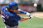 OAKLAND, CA - MAY 07:  Ian Kinsler #5 of the Texas Rangers bats against the Oakland Athletics during a Major League Baseball game on May 7, 2009 at the Oakland Coliseum in Oakland, California.  (Photo by Jed Jacobsohn/Getty Images)