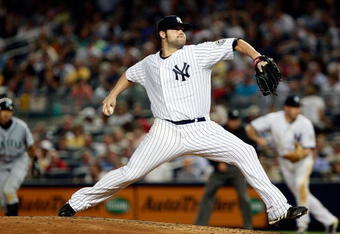 NEW YORK - JUNE 30: Joba Chamberlain #62 of the New York Yankees pitches against the Seattle Mariners June 30, 2009 at Yankee Stadium in the Bronx borough of New York City.  (Photo by Mario Tama/Getty Images)
