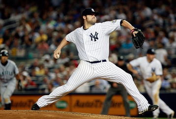 NEW YORK - JUNE 30: Joba Chamberlain #62 of the New York Yankees pitches against the Seattle Mariners June 30, 2009 at Yankee Stadium in the Bronx borough of New York City.  (Photo by Mario Tama/Getty Images)