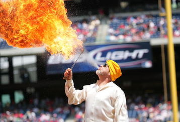 PHILADELPHIA - APRIL 29:  The Phillie Phantic's birthday was celebrated by a man eating fire prior to the game with the Phillies and Marlins on April 29, 2007 at Citizens Bank Park in Philadelphia, Pennsylvania.  The Phillies defeated the Marlins 6 to 1. (Photo by Len Redkoles/Getty Images)
