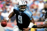 NASHVILLE, TN - SEPTEMBER 18: Quarterback Steve McNair #9 of the Tennessee Titans eludes Antwan Odom #98 of the Baltimore Ravens as the Titans defeated the Ravens 25-10 during NFL action at the Coliseum on September 18, 2005 in Nashville, Tennessee.  (Photo by Doug Pensinger/Getty Images)