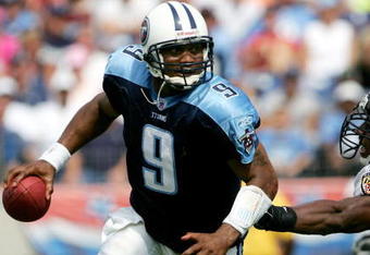 NASHVILLE, TN - SEPTEMBER 18: Quarterback Steve McNair #9 of the Tennessee Titans eludes Antwan Odom #98 of the Baltimore Ravens as the Titans defeated the Ravens 25-10 during NFL action at the Coliseum on September 18, 2005 in Nashville, Tennessee.  (Photo by Doug Pensinger/Getty Images)