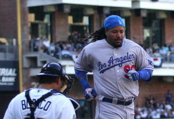 SAN DIEGO, CA- APRIL 6:  Manny Ramirez #99 of the Los Angeles Dodgers scores against the San Diego Padres during their Opening Day game on April 6, 2009 at Petco Park in San Diego, California. (Photo by Donald Miralle/Getty Images)