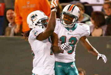 EAST RUTHERFORD, NJ - DECEMBER 28: Ernest Wilford #18 scores a touchdown and celebrates with Davone Bess #15 of The Miami Dolphins against The New York Jets during their game on December 28, 2008 at Giants Stadium in East Rutherford, New Jersey. (Photo by Al Bello/Getty Images)