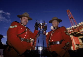 26 Nov 2000:  A view of two Mounties posing with the Grey Cup before the Grey Cup 2000 game between the British Columbia Lions and the Montreal Alouettes at the McMahon Stadium in Calgary, Alberta, Canada. The Lions defeated the Alouettes 28-26. Mandatory Credit: Craig Klem  /Allsport