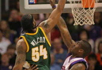 PHOENIX - FEBRUARY 8:  Chris Wilcox #54 of the Seattle SuperSonics tips the ball in over Amare' Stoudemire #1 of the Phoenix Suns on February 8, 2008 at US Airways Center in Phoenix, Arizona. NOTE TO USER: User expressly acknowledges and agrees that, by downloading and or using this Photograph, user is consenting to the terms and conditions of the Getty Images License Agreement.(Photo by Domenic Centofanti/Getty Images)